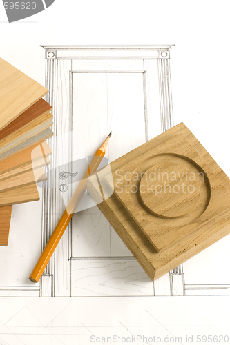 Image of design of door with pencil, oak rosette and wood patterns