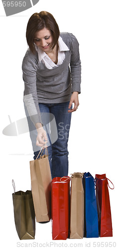 Image of Young woman with shopping bags