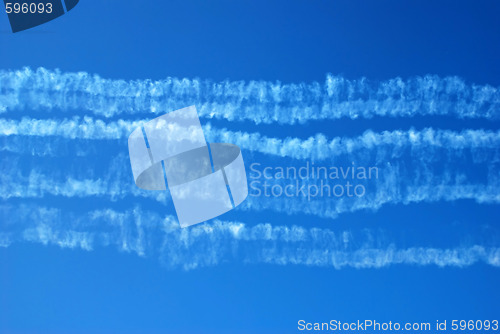Image of Smoke traces in blue sky