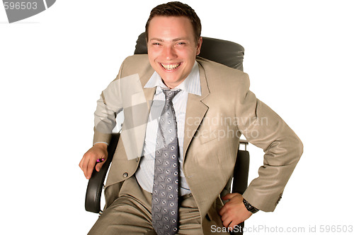 Image of Young businessman sitting in chair 