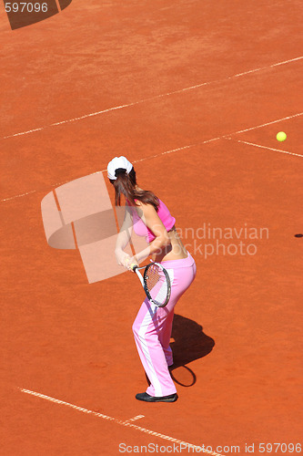 Image of Woman playing tennis