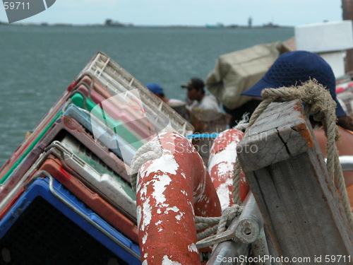 Image of Crates and a Lifebuoy on a Boat