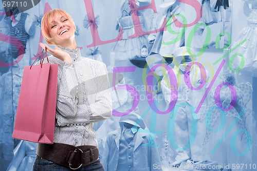 Image of happy young girl with colored bags