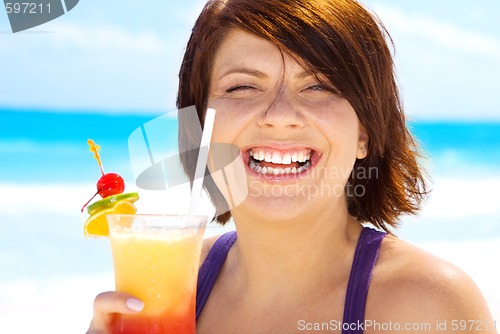 Image of happy woman with colorful cocktail