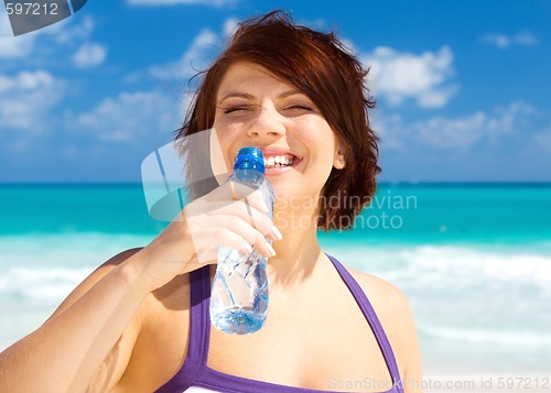 Image of happy woman with bottle of water