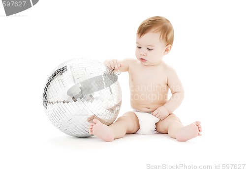 Image of adorable baby boy with big disco ball