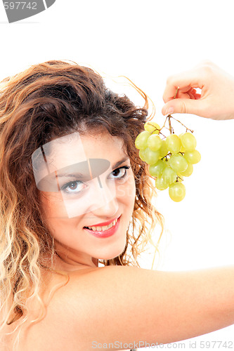 Image of attractive woman with bunch of grapes