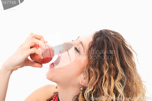 Image of woman eating a red apple.