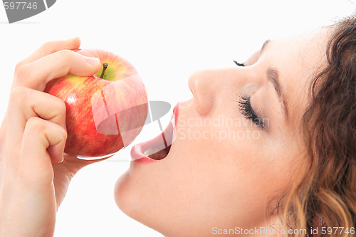 Image of woman eating a red apple.