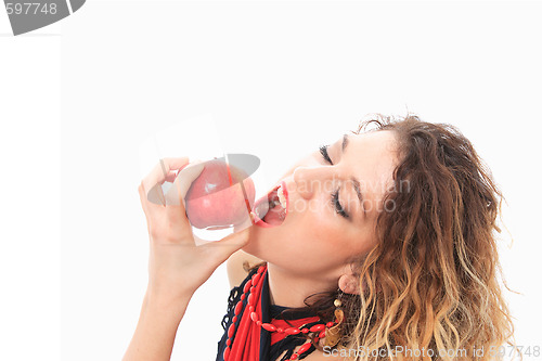 Image of woman eating a red apple.