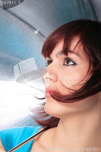 Image of beautiful girl under an umbrella 