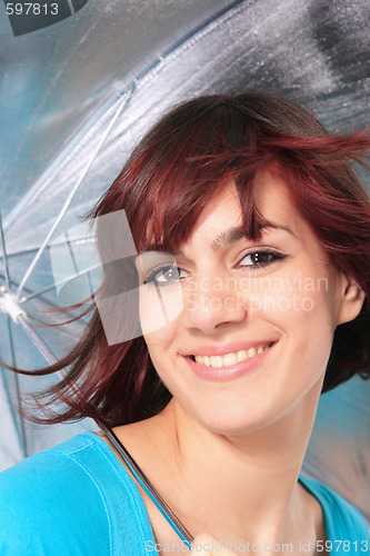 Image of beautiful girl under an umbrella 