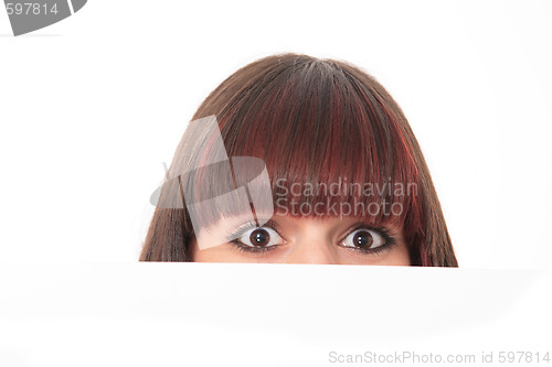 Image of Beautiful woman holding empty white board