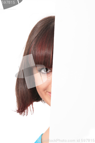Image of Beautiful woman holding empty white board