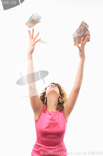 Image of Cheerful young lady holding cash