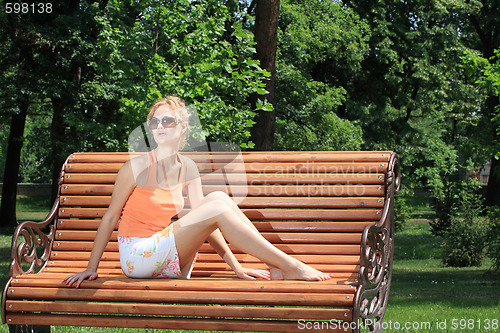 Image of Beautiful woman  enjoying the sun