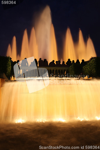 Image of tourists photographing fountain in city Barcelona, Spain