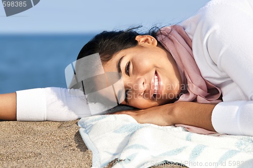 Image of Young native american woman at beach