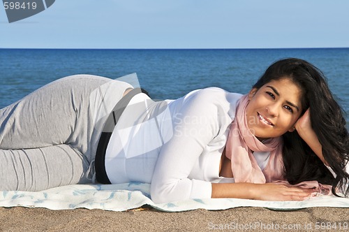 Image of Young native american woman at beach