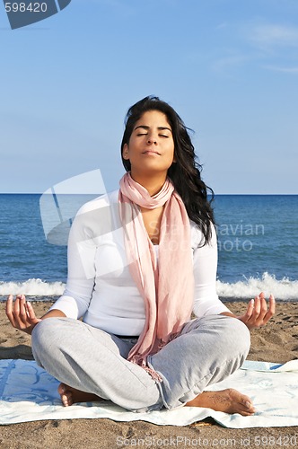 Image of Young native american woman meditating