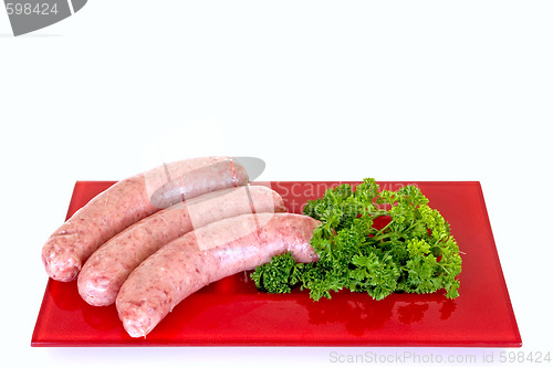 Image of Sausages on red plate