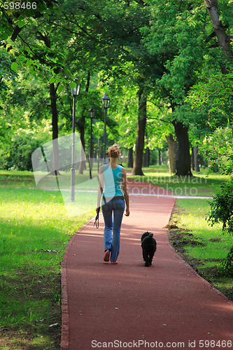 Image of girl and her dog walking