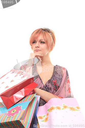 Image of happy young girl with colored bags