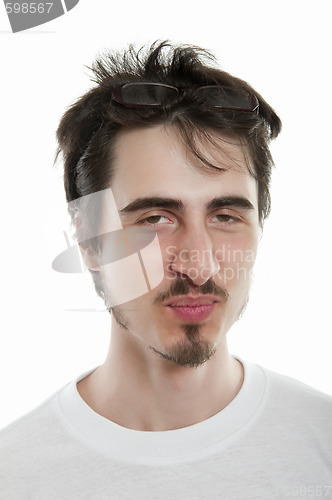 Image of young man glare forward in defiance