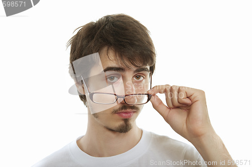 Image of Young man take his glasses off