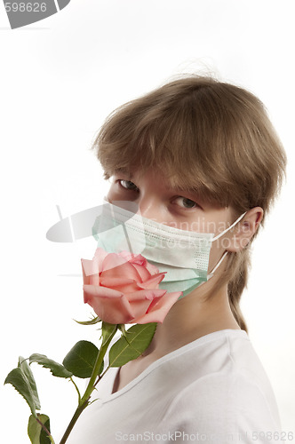 Image of Young woman wearing mask 