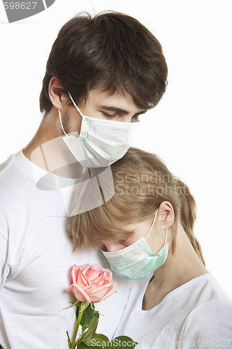 Image of Affectionate couple with pink  rose 