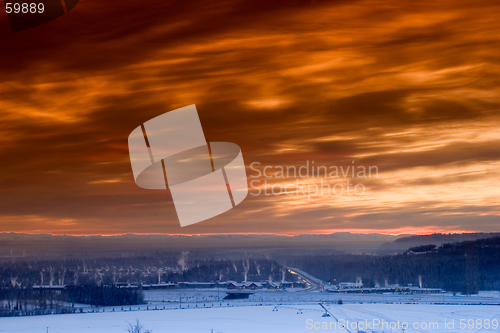 Image of Sunset over frozen town