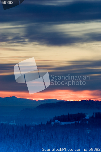 Image of Winter sunset with blurred horizon, vertical