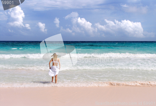 Image of Girl splashes in surf