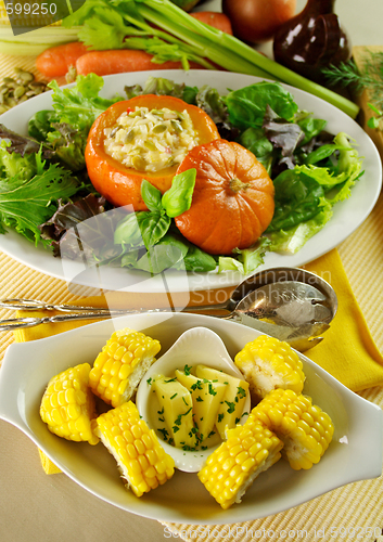 Image of Corn Cobs And Stuffed Pumpkin