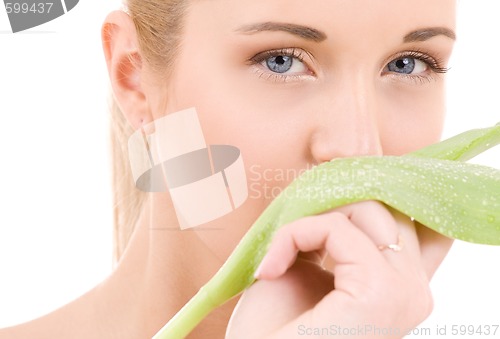 Image of woman with green leaf