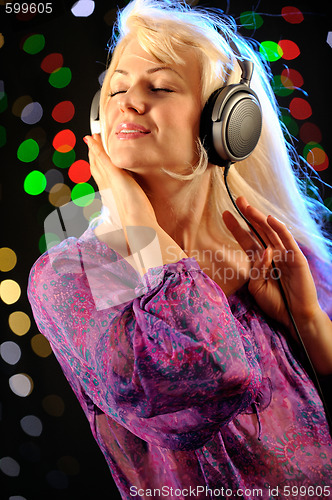 Image of Beautiful woman listen music