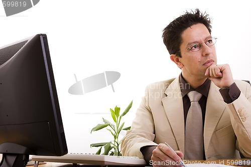 Image of businessman working at his office 