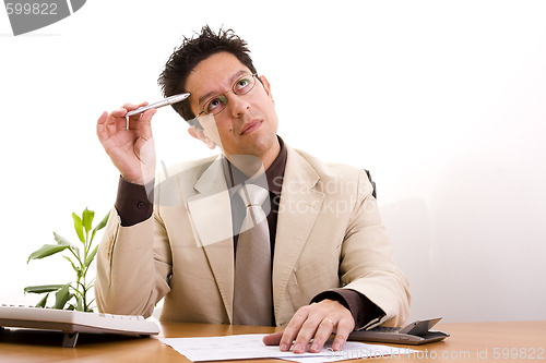 Image of businessman working at his office 