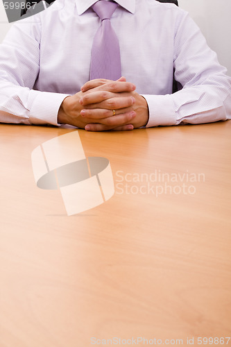 Image of Businessman cross hands