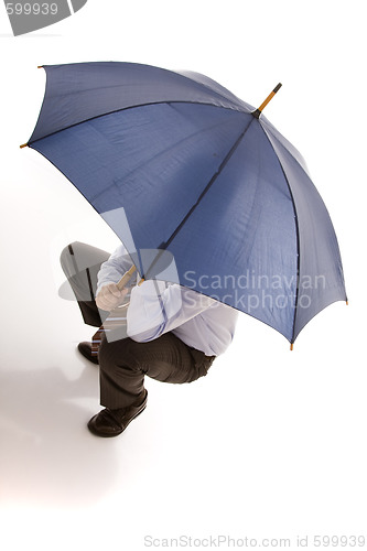 Image of hiding bewind an umbrella