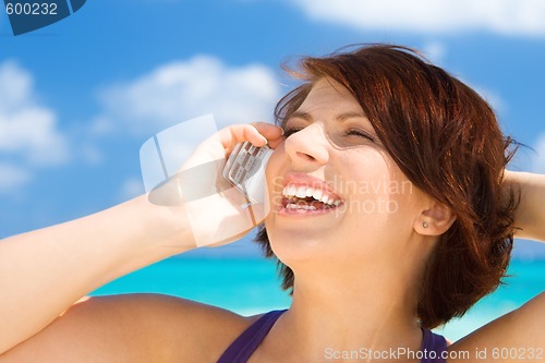 Image of happy woman with cell phone