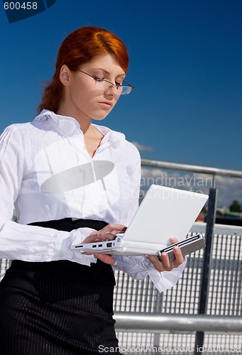 Image of businesswoman with laptop computer