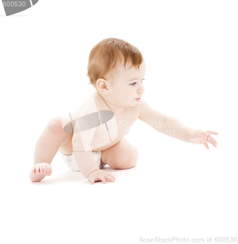 Image of crawling baby boy in diaper