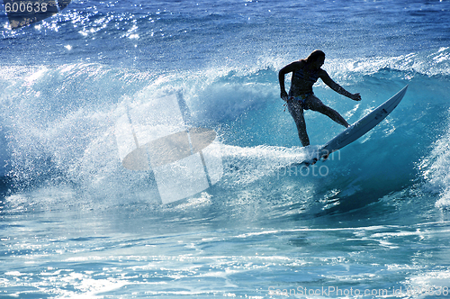 Image of Hawaii, Kauai - Oct 21, 2008: Surfer girl Malia Rimavicus jumps over the lip of a wave at training