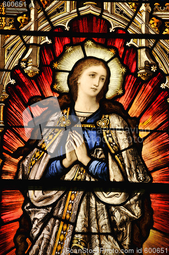 Image of Stained Glass window of St Mary in contemplative prayer