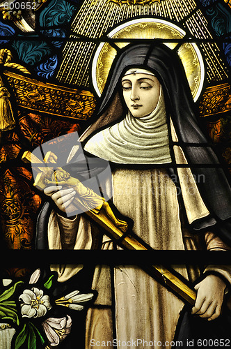 Image of Stained Glass window of St Monica holding the cross of Jesus Chr
