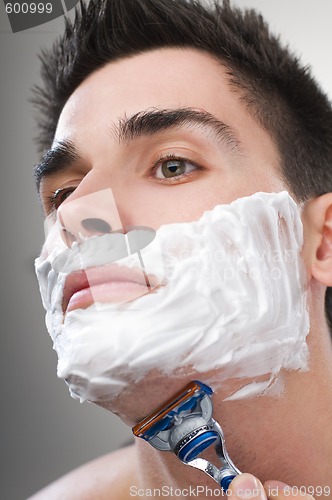 Image of Man shaving