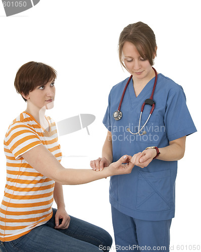 Image of Nurse measuring patient's pulse