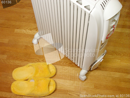 Image of Oil heater and plush slippers